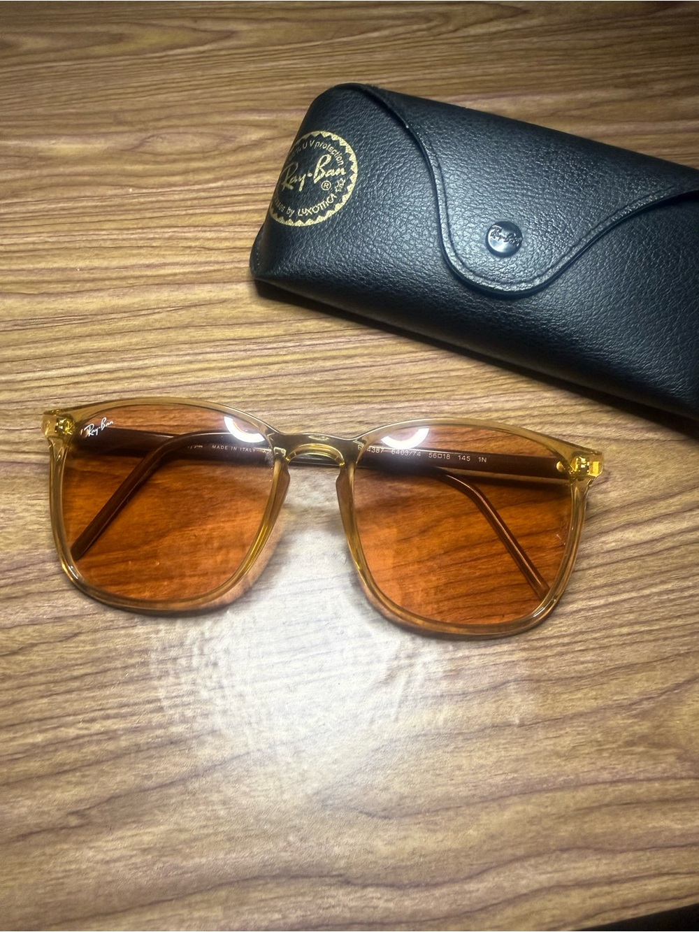 Ray-Ban rectangle sunglasses. Amber frame, EVOLVE amber lenses. RB 4387.